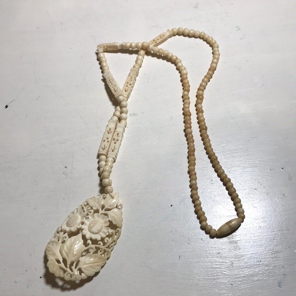 Long fake ivory floral beaded necklace